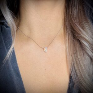 Handmade Fire Opal necklace worn on model’s neck for size and style reference