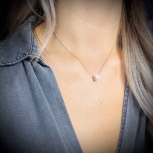 Handmade Pink Opal necklace worn on model’s neck for size and style reference